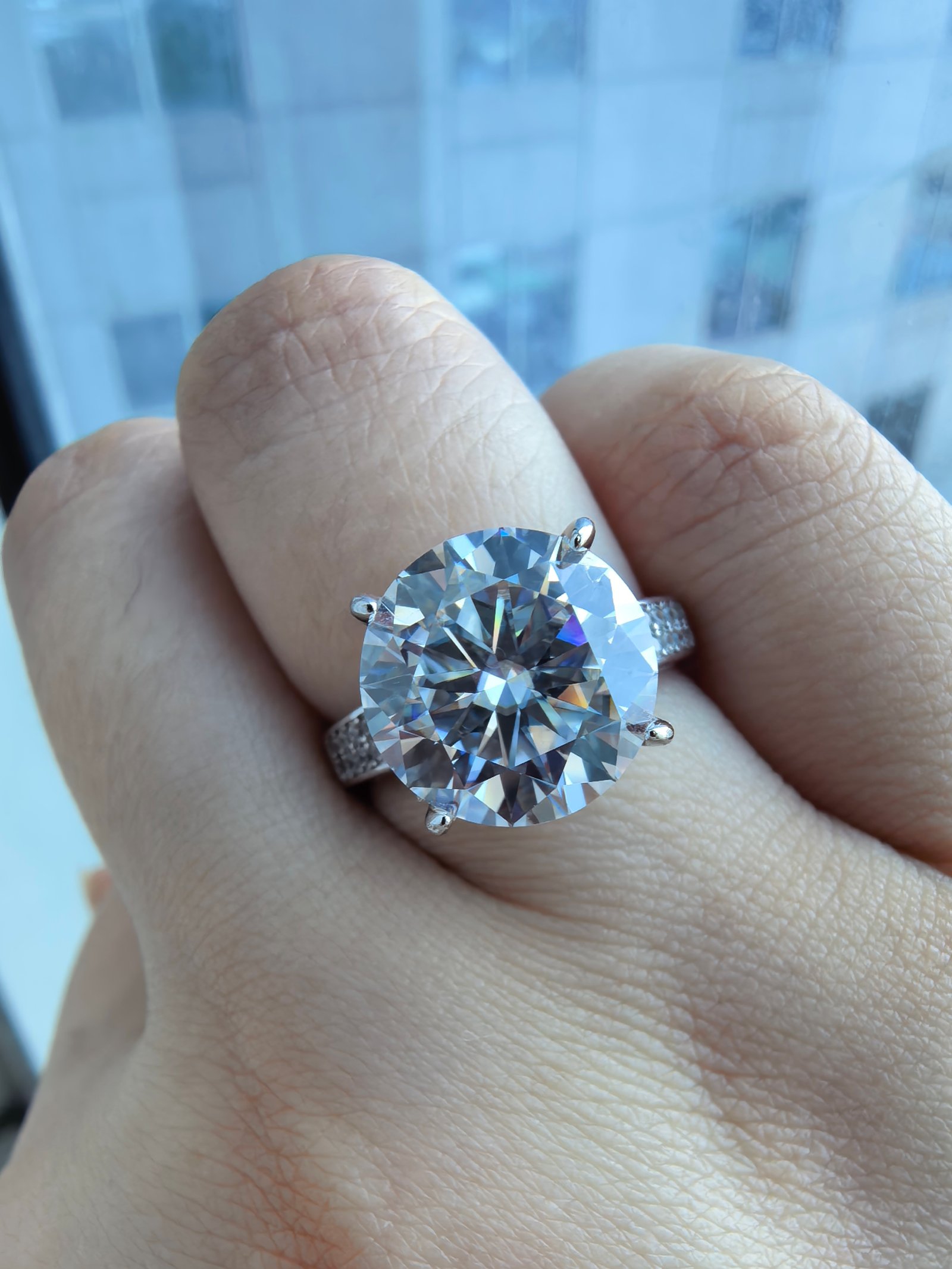 5 carat round flat solitaire engagement ring with side stones 